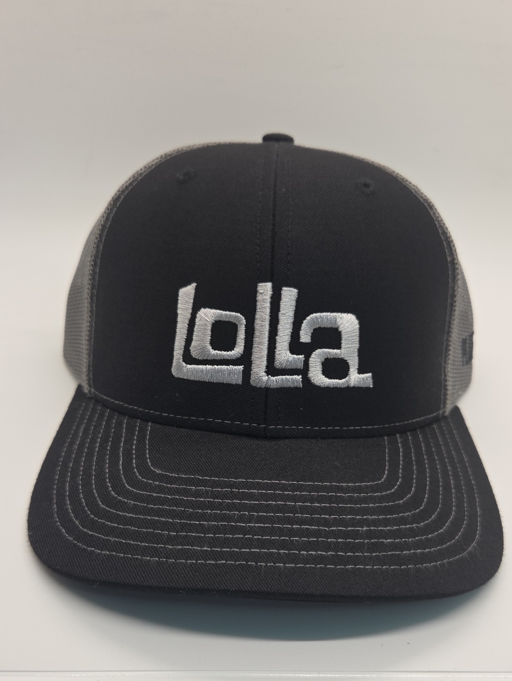 Lolla Embroidered Trucker Hat in Black and Gray Snapback Unisex